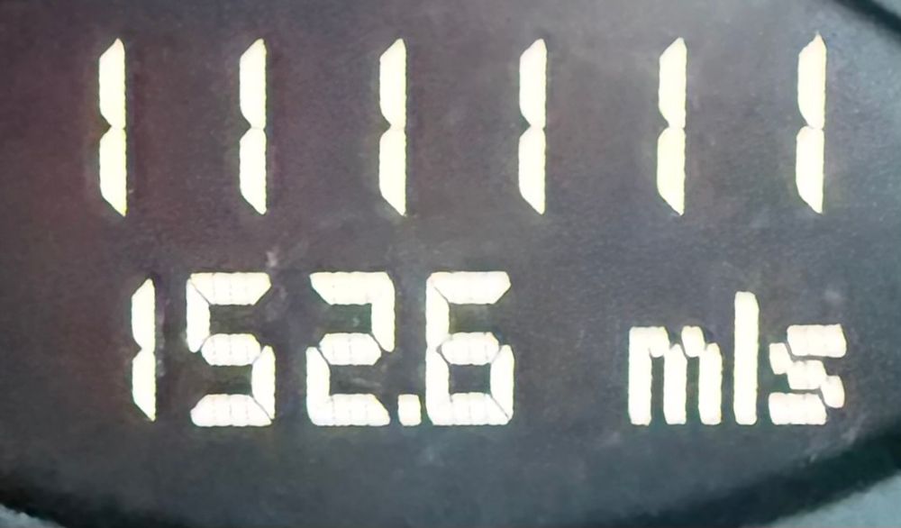 The odometer of my 2009 Porsche Cayman showing a mileage of 111111. All the ones.