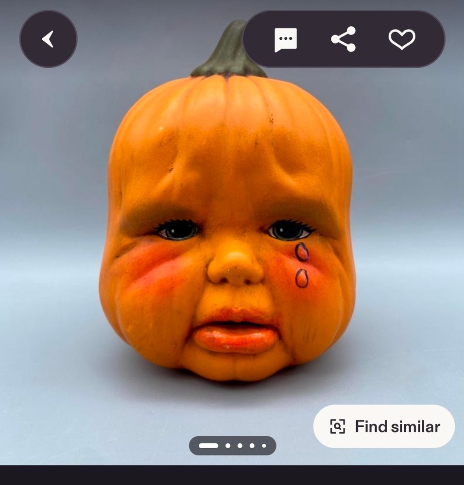 A crying chubby baby pumpkin head in ceramic on Etsy. It looks like a real baby but pumpkin. Tears are drawn on