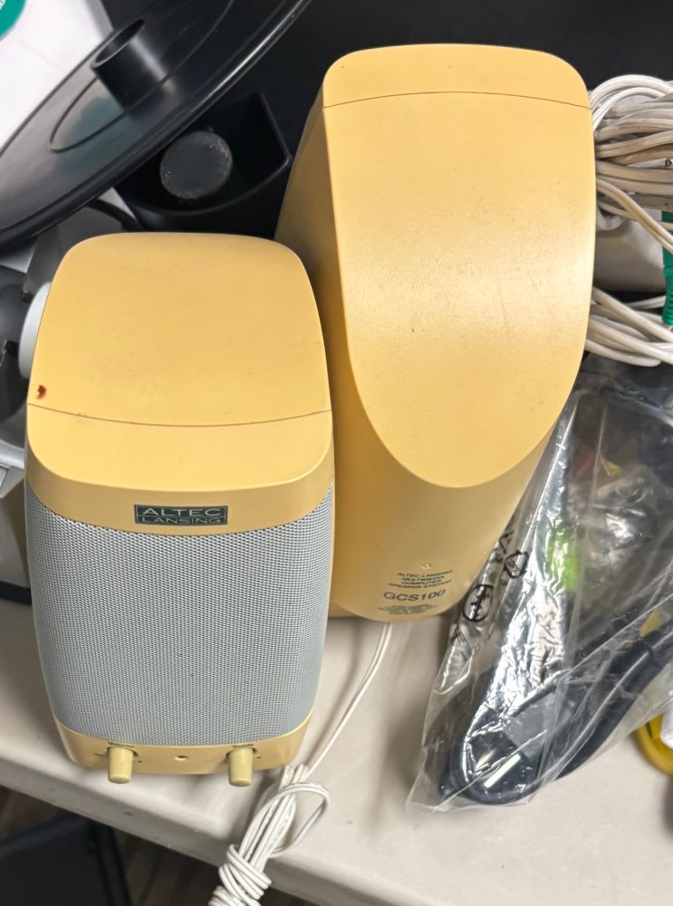 Old yellowed computer speakers.