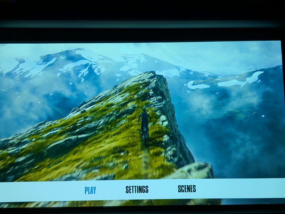 Tom Cruise riding a bike off a mountain 