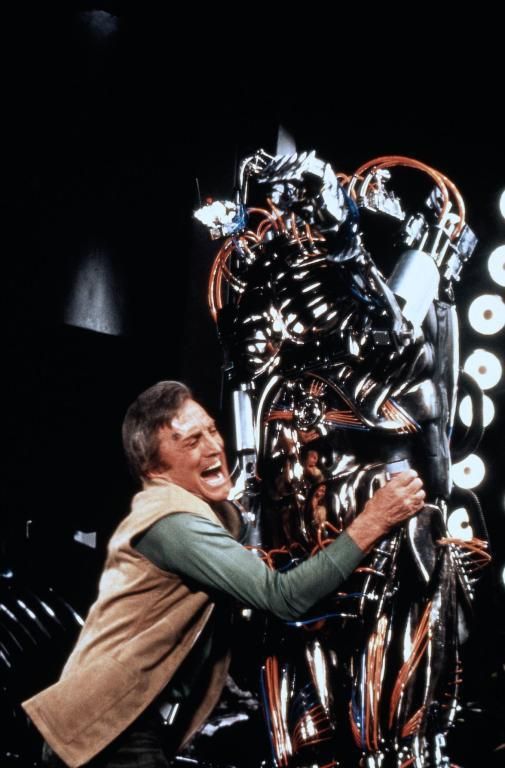 A still from the 1980 movie "Saturn 3" featuring Kirk Douglas' character that in context trying to ineffectively fight Hector the Killer Robot but in freeze frame just clinging to the robot's waist and hips. This is a very funny visual joke given the context of the thread. Very good joke. Everyone laugh. Roll snare drum. Curtains.