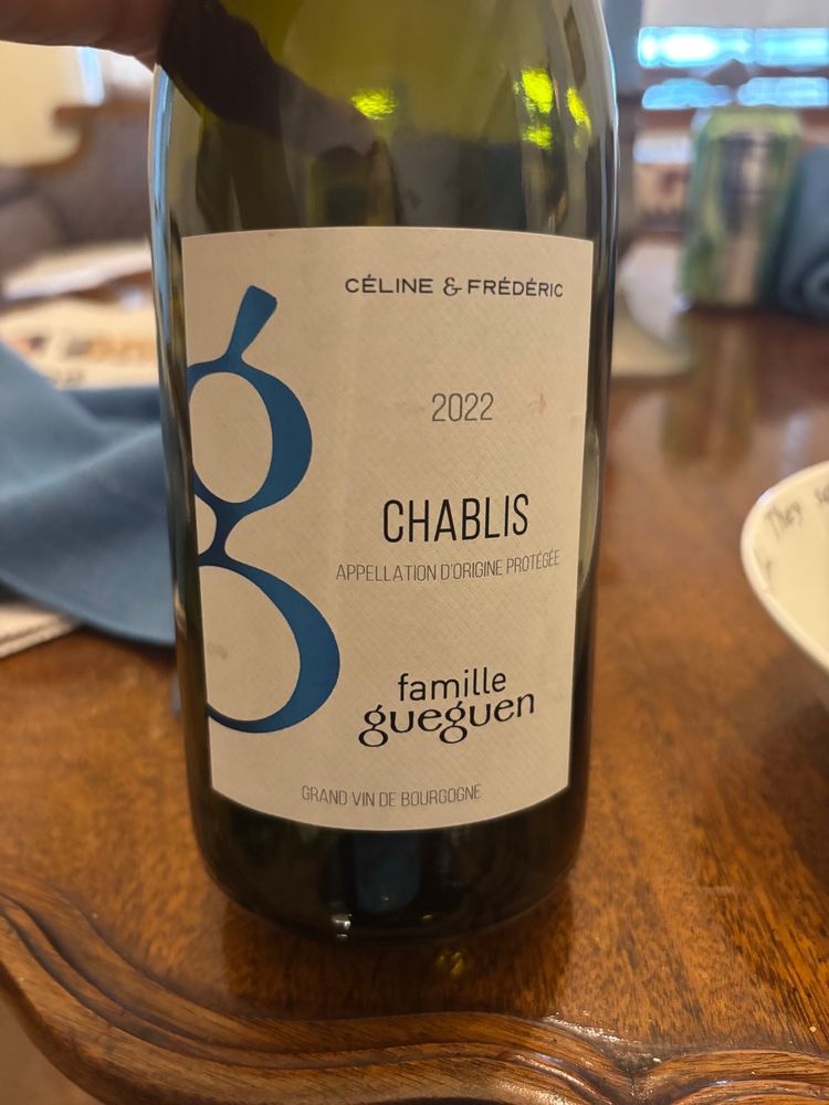 Wine bottle from famille gueguen Chablis featuring a very large lowercase “g” on the label.
