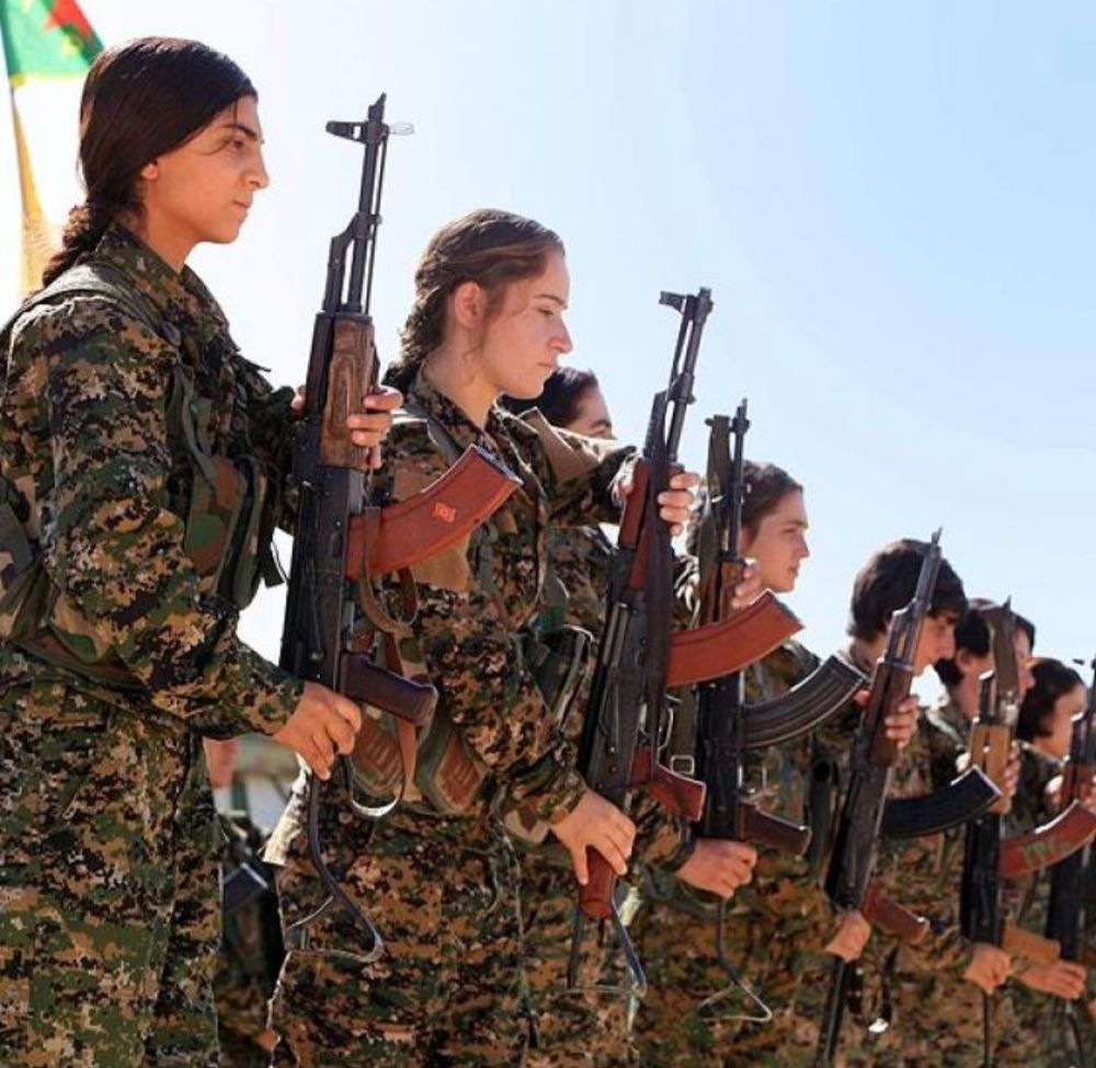 Kurdish women soldiers holding rifles 
