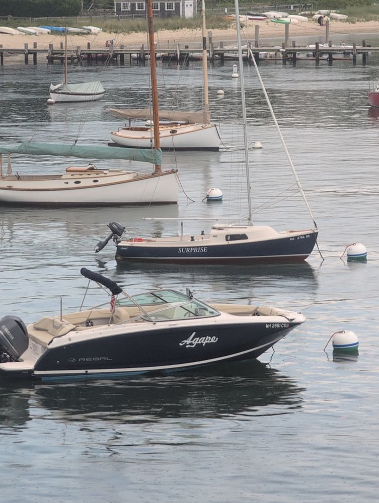 Two boats one named agape the other surprise