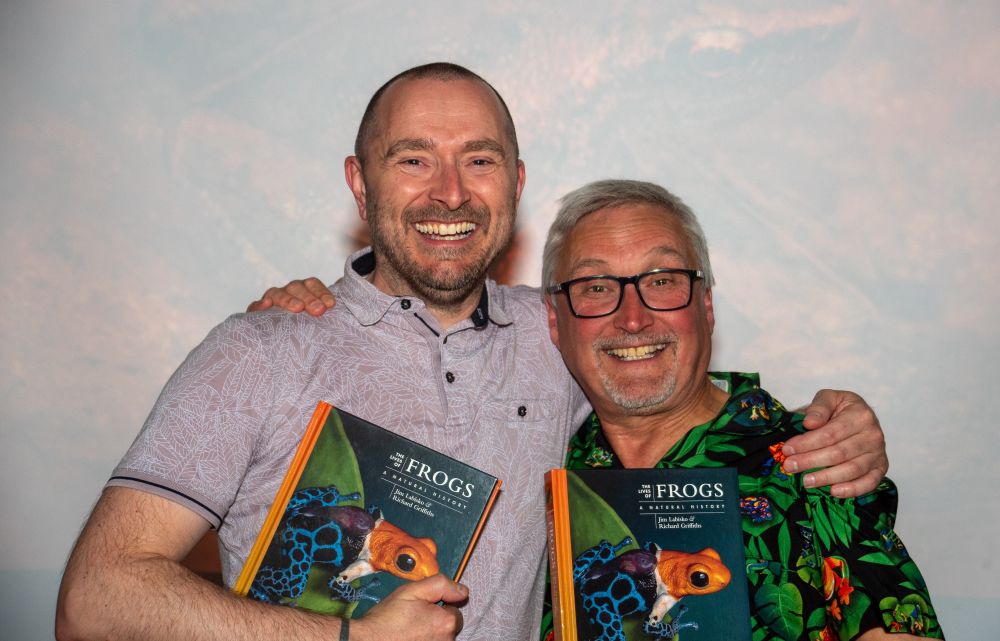 Jim Labisko and Richard Griffiths holding copies of their new book 'The Lives of Frogs' at the soft-launch event in May 2025. Frog-themed wine and beer consumed but not shown. Special mention of Richard's tropical forest and frog-themed shirt putting an underdressed Jim to shame

Photo by Chloe Wellecomme