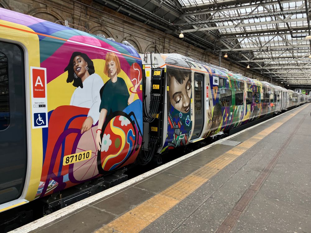 Avanti West Coast train with colourful illustration of different people, including wheelchair users