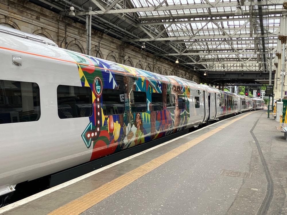 Avanti West Coast train carriage with colourful illustration of different people and plants
