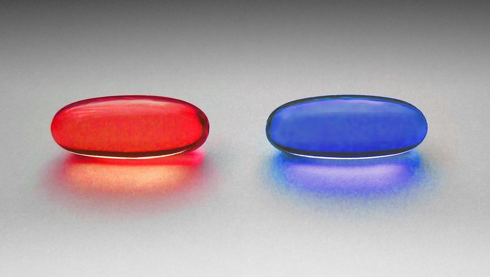 A picture of a blue pill and a red pill. A reference to the matrix film.