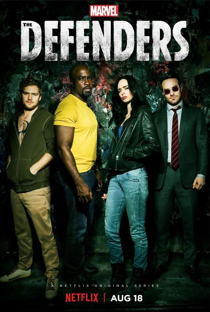 Poster for Marvel's The Defenders Netflix original series. It features the four main characters standing in front of a gritty, graffiti-covered wall. From left to right: Danny Rand/Iron Fist (wearing a hoodie, chest tattoo visible), Luke Cage (in a yellow shirt, arms crossed), Jessica Jones (in a leather jacket and jeans), and Matt Murdock/Daredevil (wearing a suit and red-tinted glasses). The title “THE DEFENDERS” appears in large white distressed text above them, with the Marvel logo above the title. The release date “AUG 18” and the Netflix logo are at the bottom.

