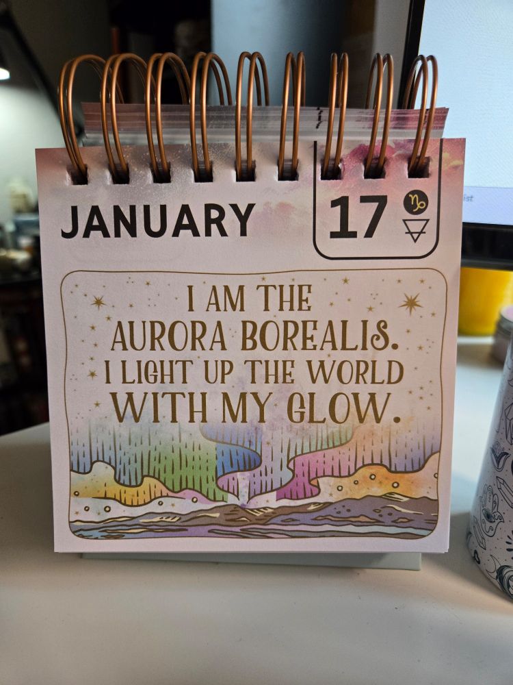 January 17th page of a desk calendar with an illustration of the aurora borealis. "I am the aurora borealis. I light up the world with my glow."