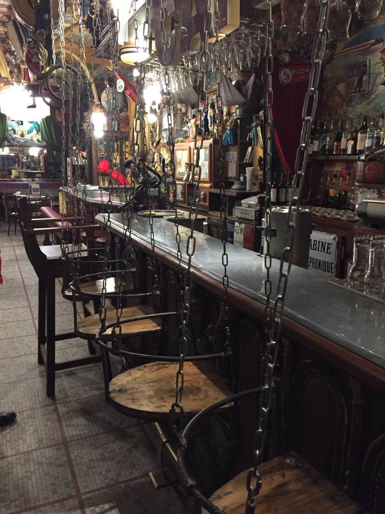 Very quirky children’s play park swings as bar seats in a French pub. All fun and games until you try and use them and your knee caps are shattered against bar. At least the alcohol they sell is a passable anaesthetic.
