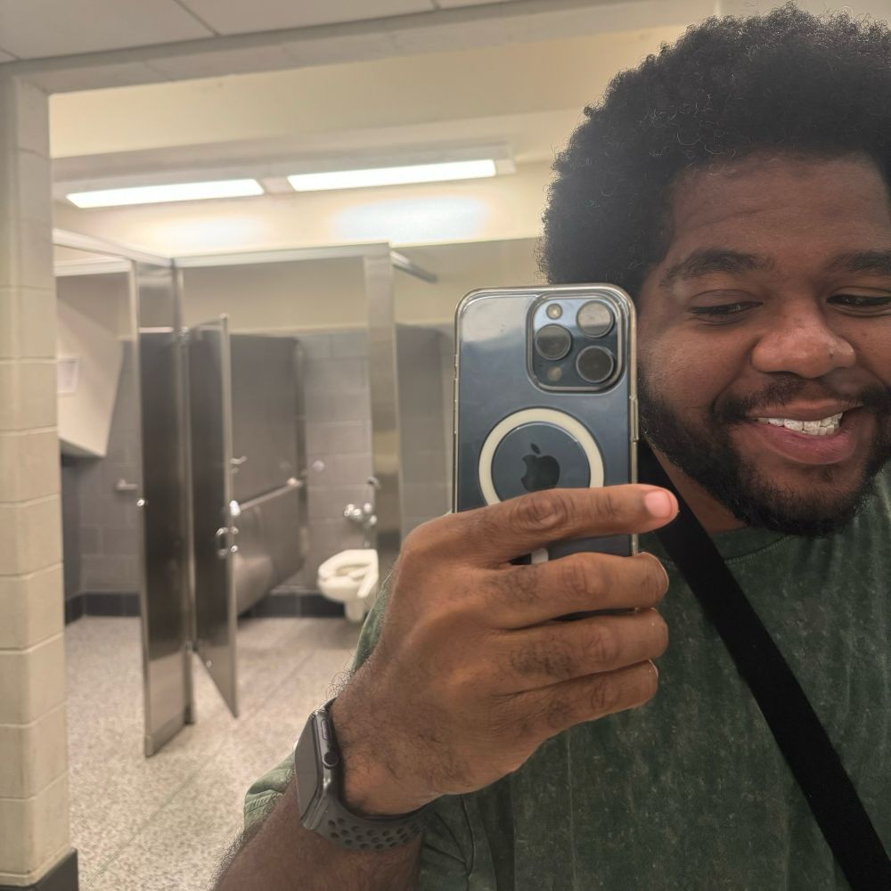 a selfie of me smiling in the mirror 