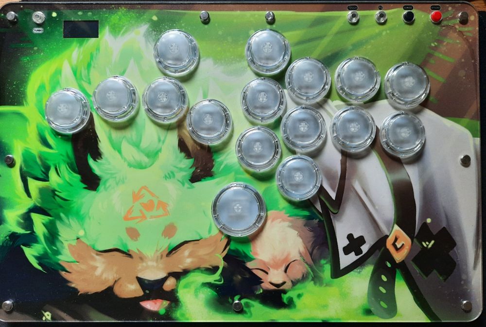 Leverless fighting game controller with art of Rei and Ramlethal's dog on display