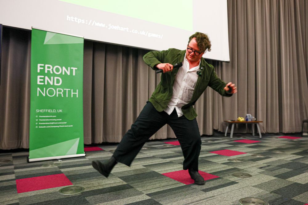 Speaker Joe Hart having fun on stage (I'm not really sure what he was doing, but it looks fun)