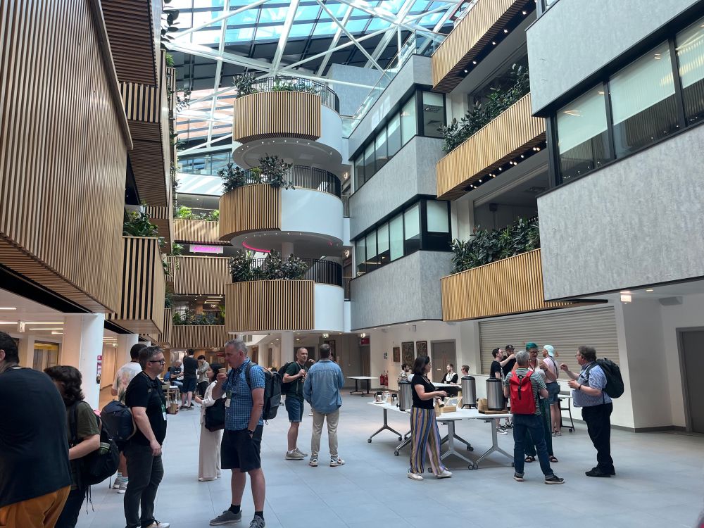 Atrium with buzzing with people and coffee  