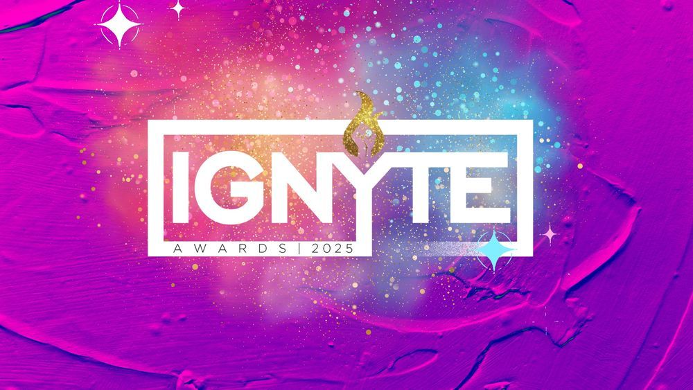 The Ignyte Awards logo is white letters covered by gold sparkles and blue sparks, against a deep pink background.
