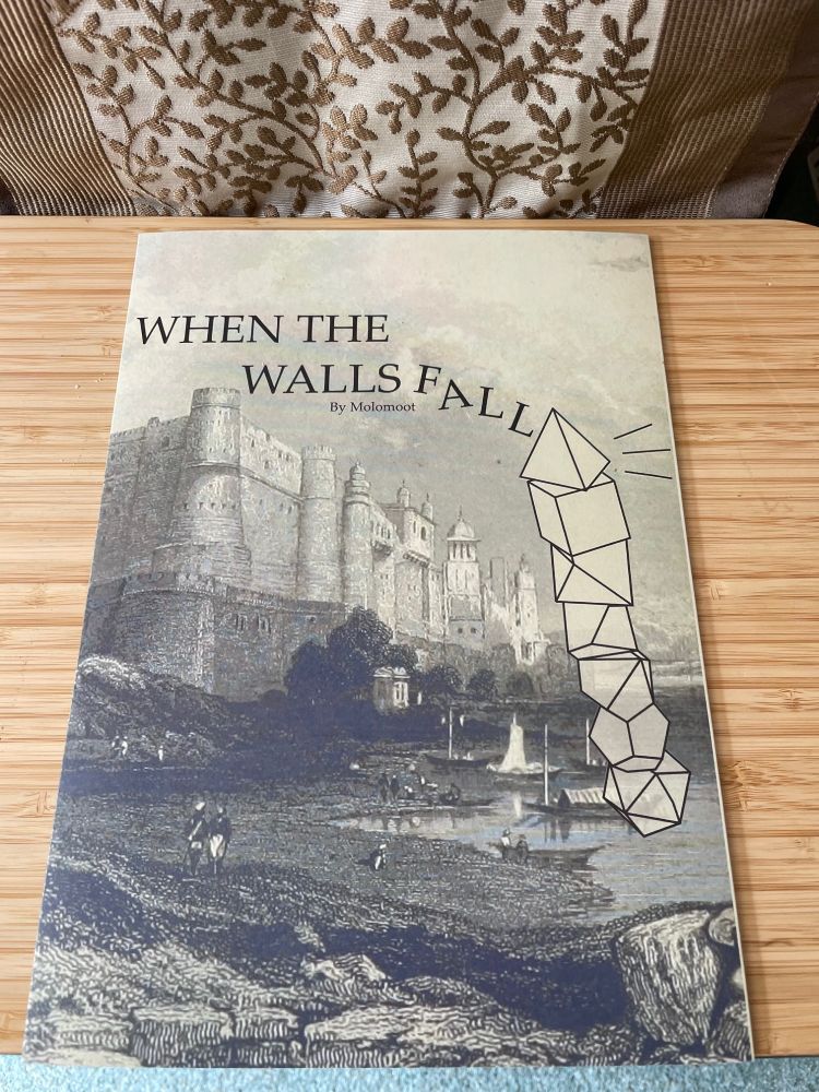 The cover to When the Walls Fall shows a drawing of a castle, with dice falling down one side of it and the title WHEN THE WALLS FALL by MOLOMOOT at the top.

aryn has long dark hair. Both are wearing jeans and t-shirts.
