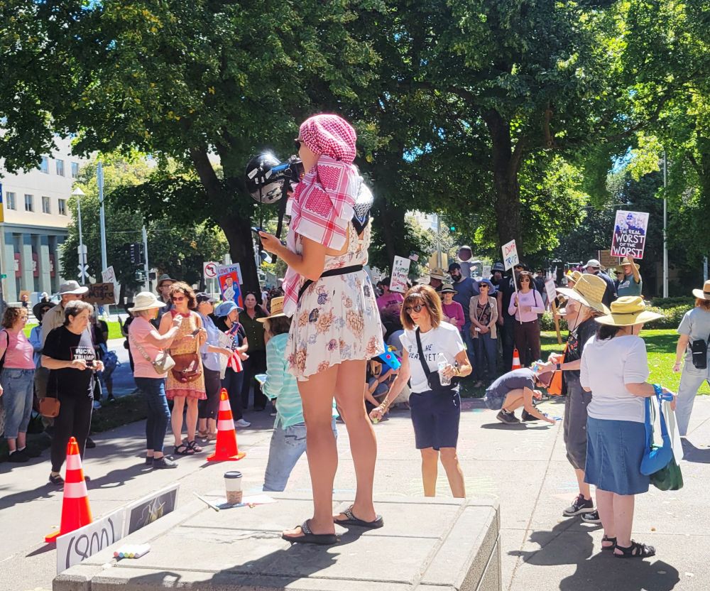 Crowd scene, speaker with bullhorn