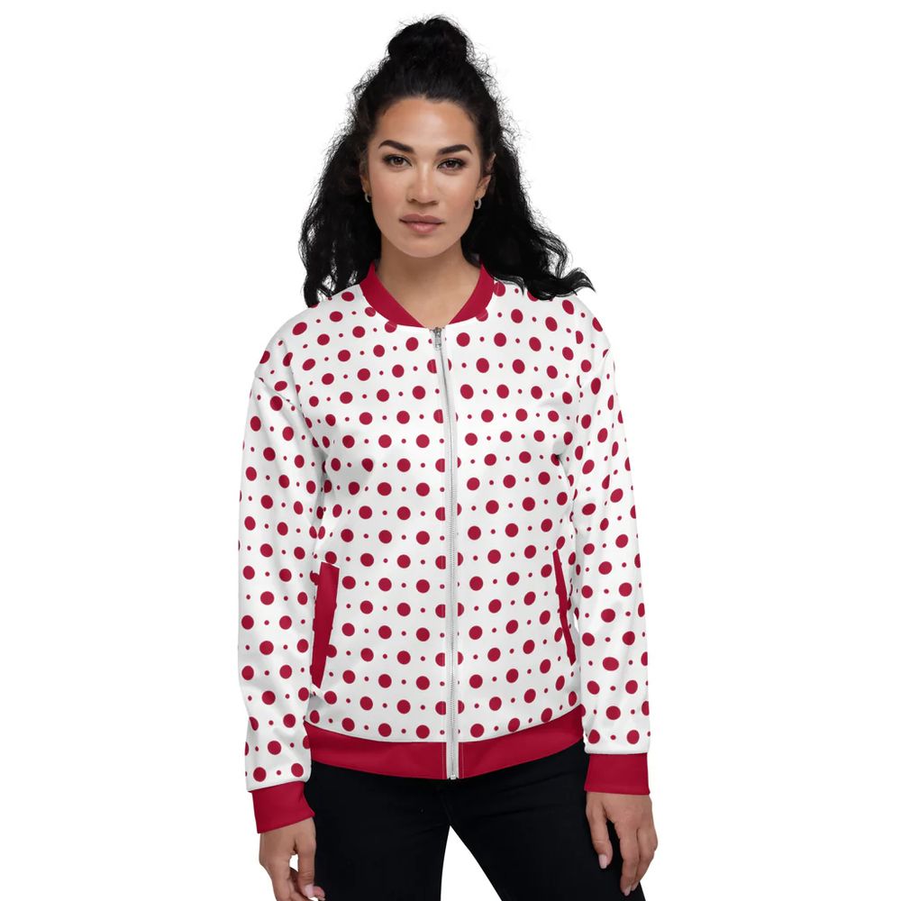 A model wearing a bomber with red dots