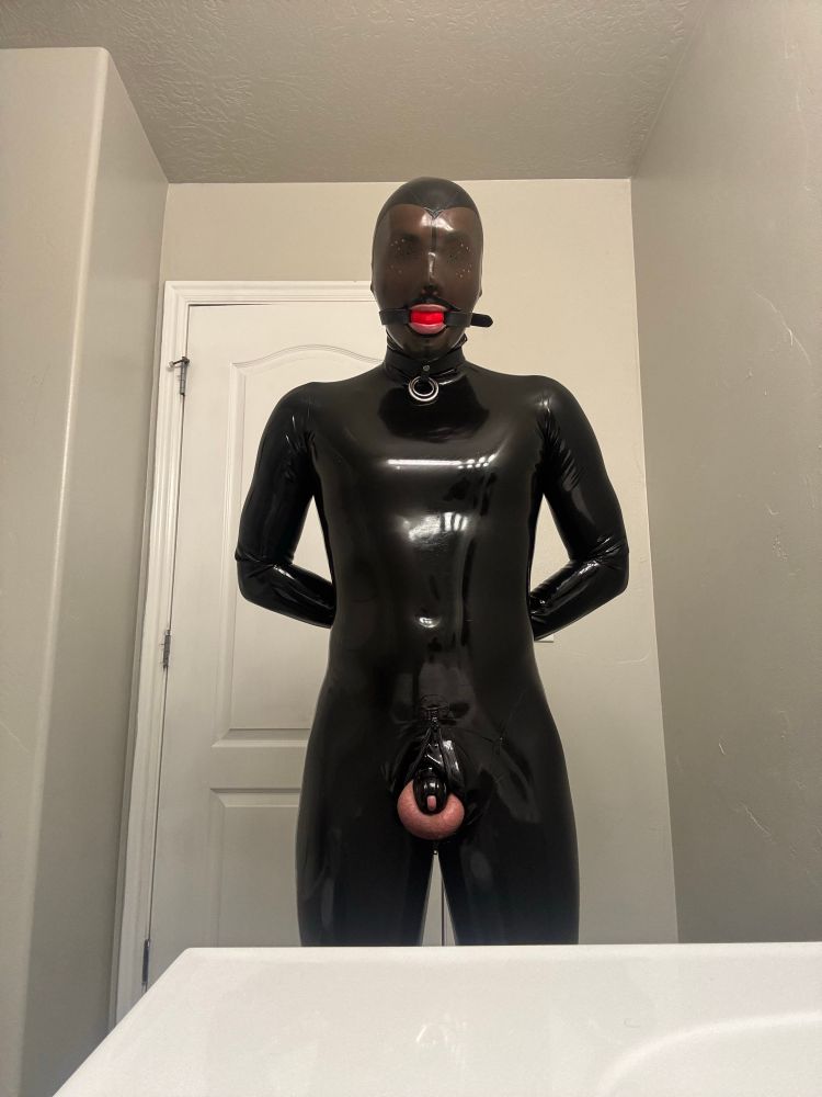 Black Latex catsuit with chastity cage and latex hood and ball gag