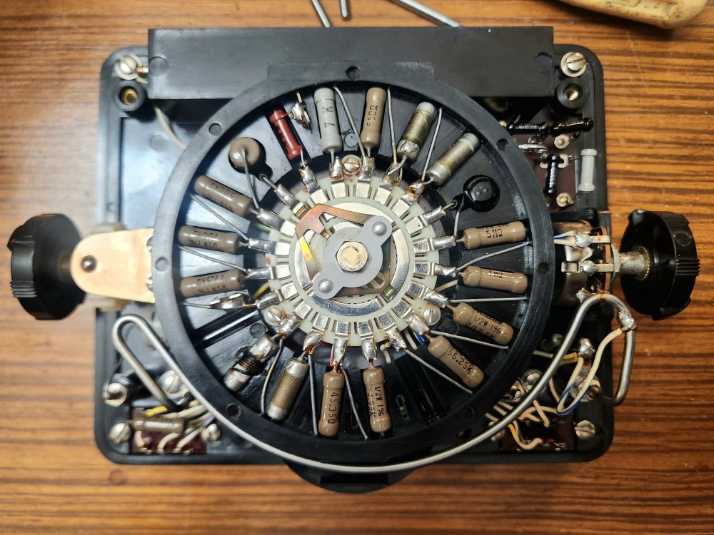 Multimeter range switch inside with a ring of resisors.