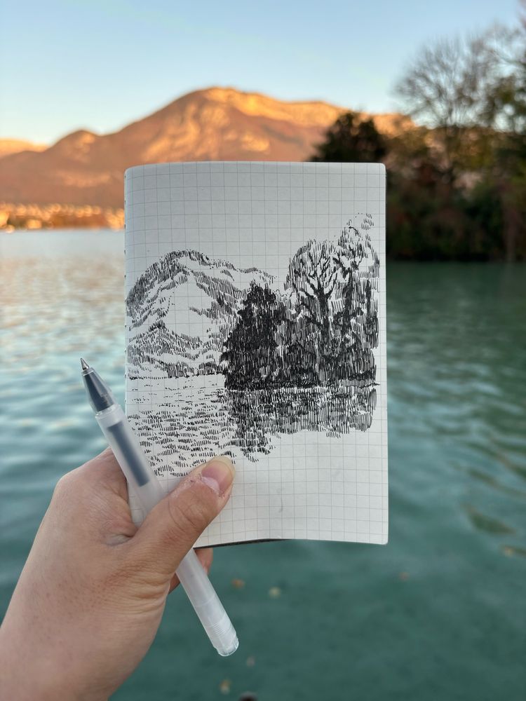 Sketchbook drawing of the lake and its mountains in Amnecy