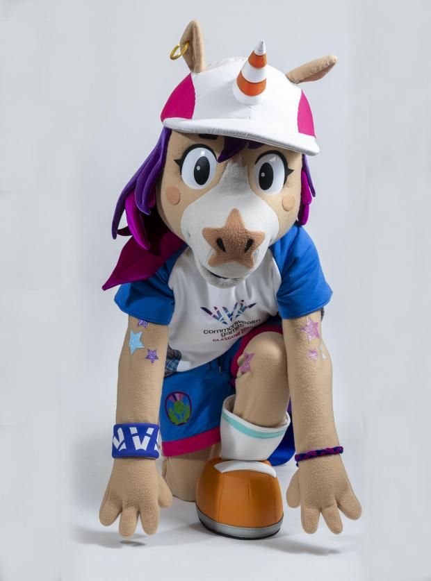 Mascot costume;  a sporty child reimagined as a  humanoid horse. It has a unicron horn, but it's a traffice cone. It's called Finnie, a unicorn with a traffic cone for a horn. Mascot for Glasgow Commonwealth Games 2026 

