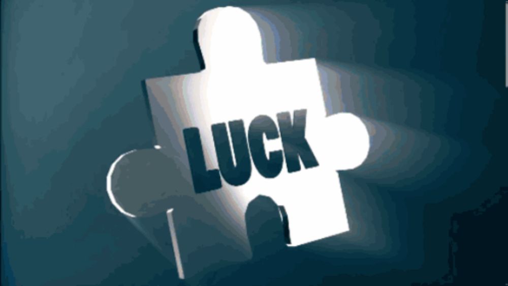 a piece of puzzle with the word luck written on it