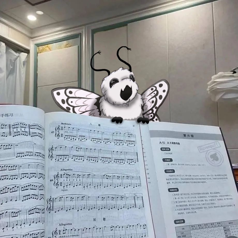 Pencil sketch with digital colouring, edited into a photo of a music notes book. 
The drawn image added in is Nimbus from the TSAMS Backstage AU, a cat sized moth like creature. Mouth wide open like she's singing. 