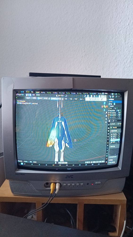 an old tube tv with blender 3d running, editing a mesh