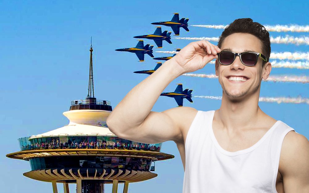 Man wearing sunglasses smiling as the U.S. Navy Blue Angels fly around the Space Needle