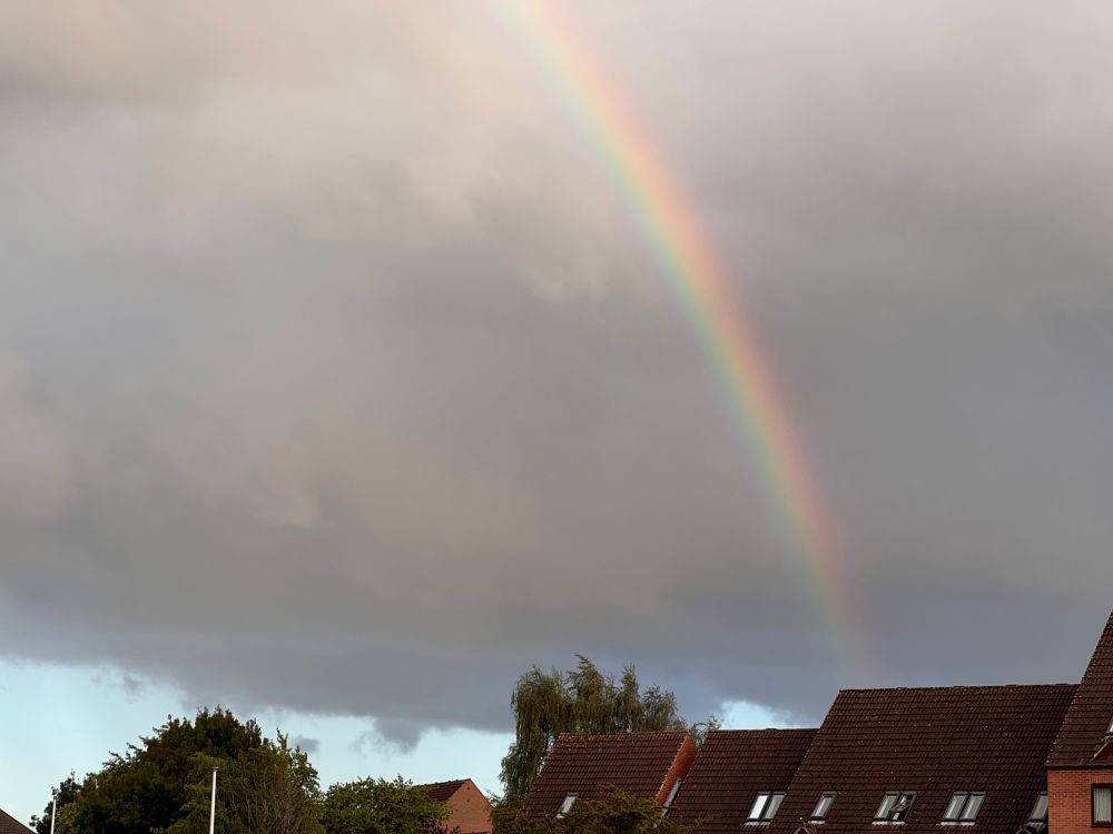 Rainbow across a grey sky