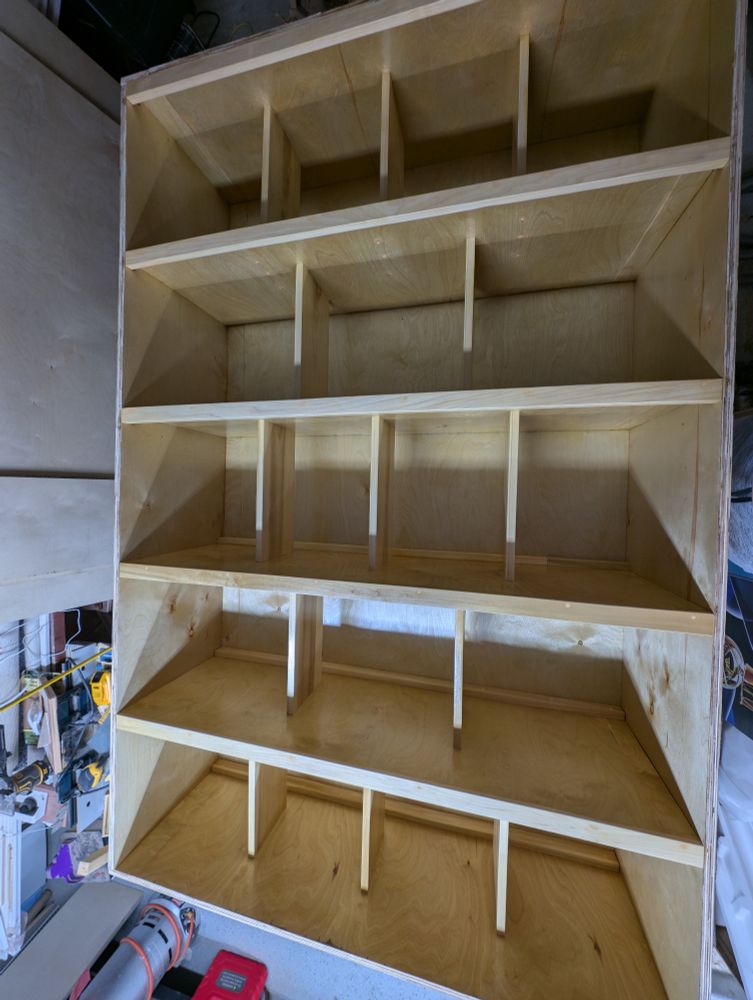Buzz's vinyl record cabinet, in a natural color with a satin polyurethane finish. 