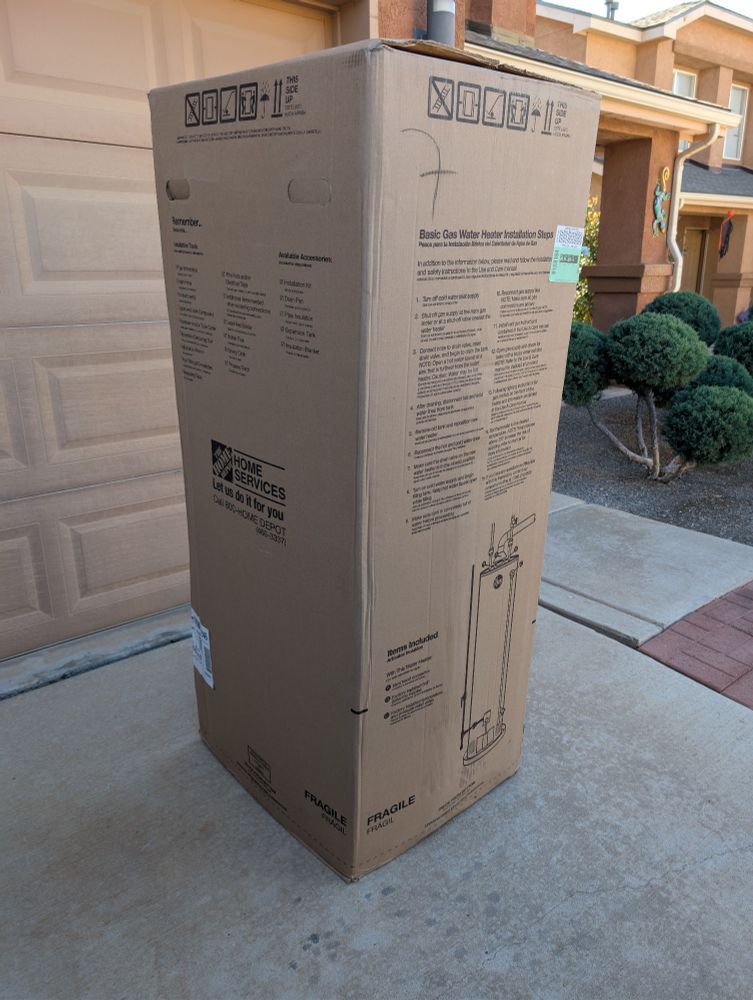 A water heater in a box on my driveway. It is taunting me to install it. Sigh. Fine. Whatever. Let's get on with it.