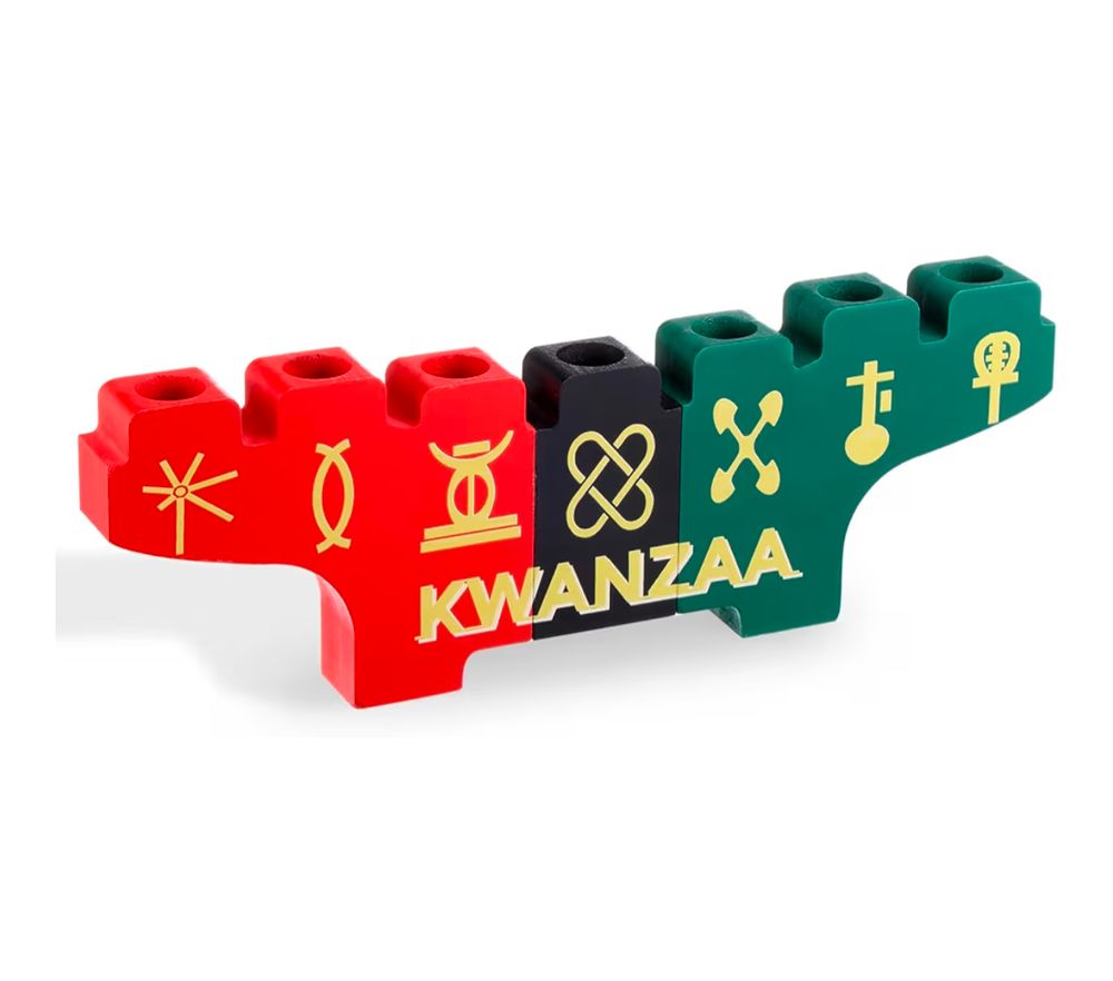 A Kwanzaa Kinara in red, black, and green with gold symbols and "Kwanzaa" on it.