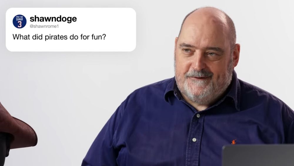 a screen grab from a WIRED YouTube video, where a historian is answering the Twitter question “What did pirates do for fun?” 
