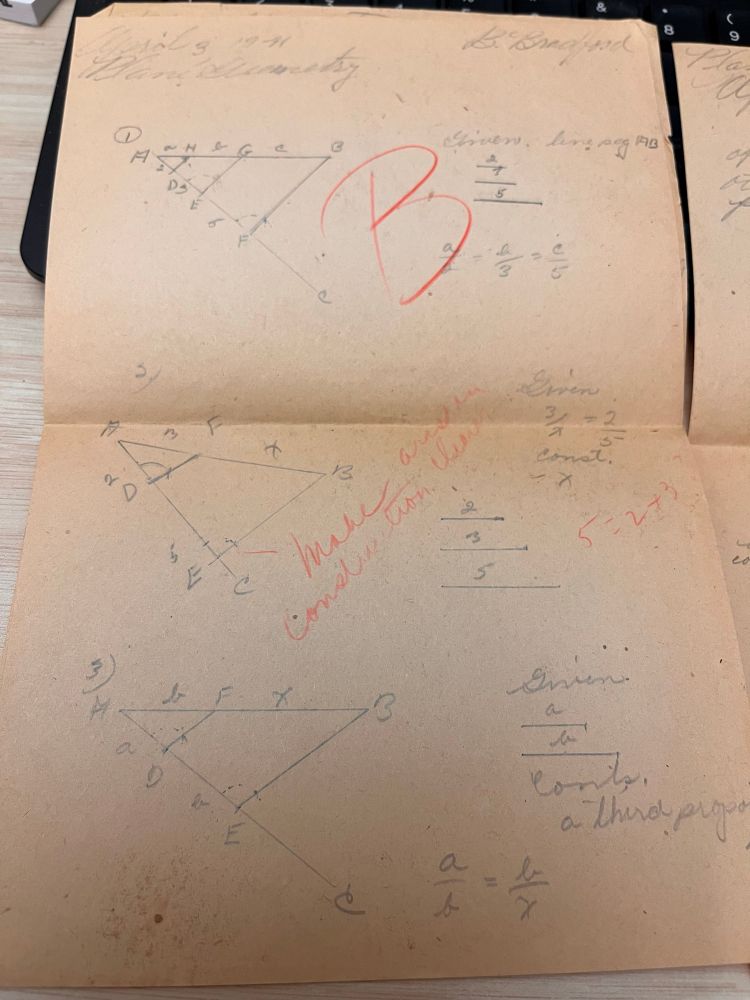 Browned page with pencil geometry problems and proofs. The teacher has written “B” and some corrections across a portion in red pencil. 