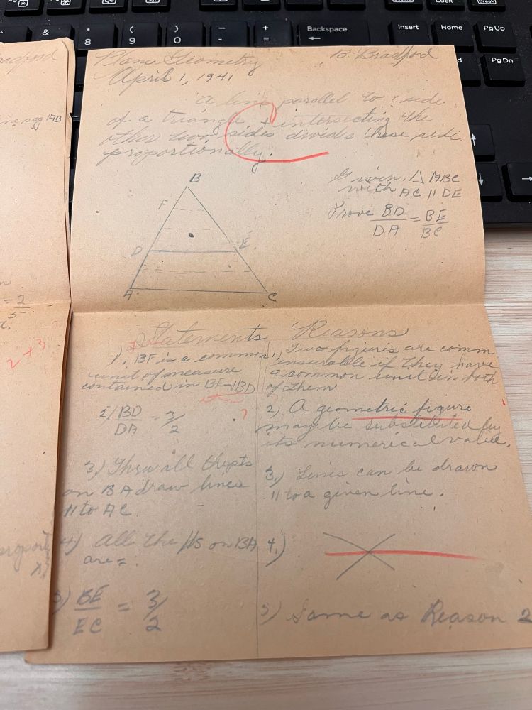 Browned page with pencil geometry problems and proofs. The teacher has written “C” and some corrections across a portion in red pencil. 