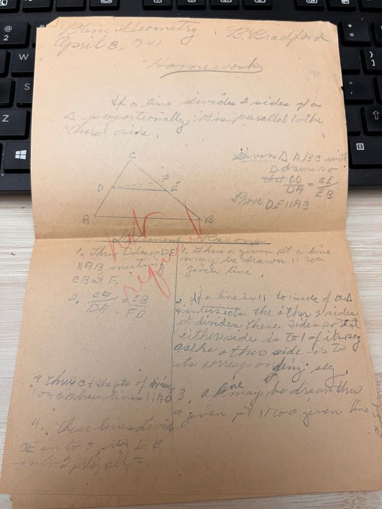 Browned page with pencil geometry problems and proofs. The teacher has written “not required” across a portion in red pencil. 