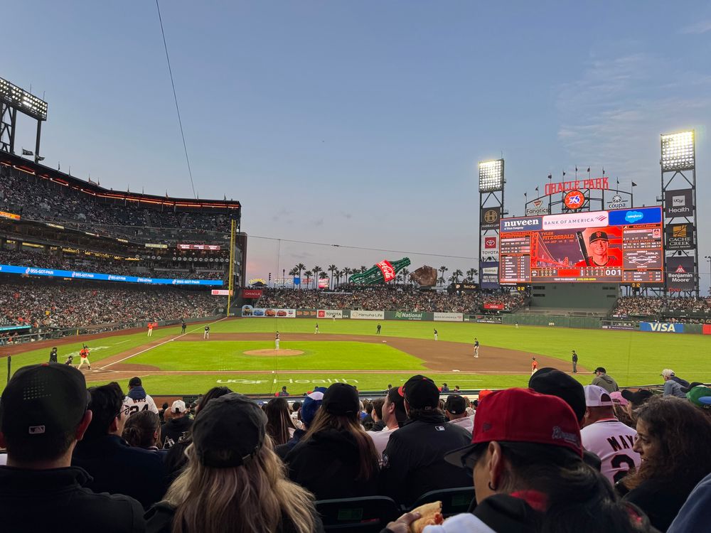 An image of oracle park and a baseball field showing the giants and Braves playing 