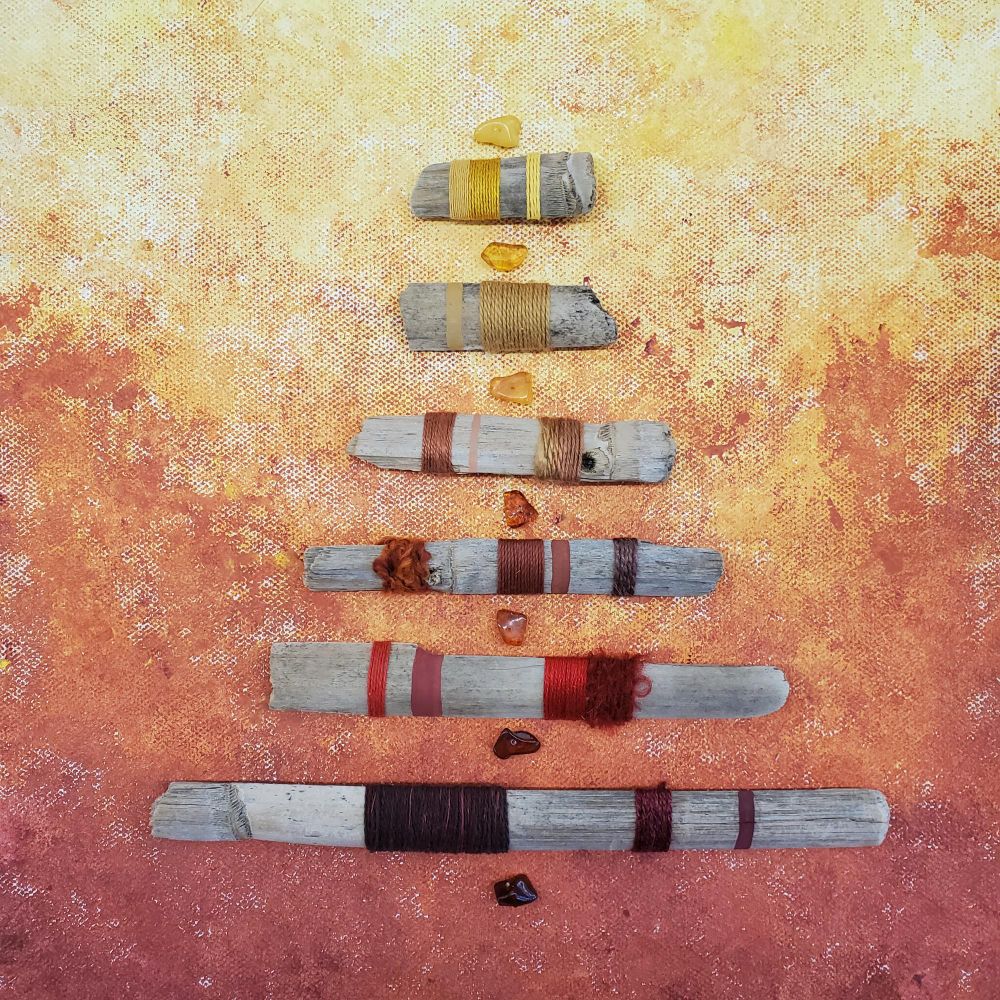 "Burning Embers" fiber art mixed media assemblage captures the transformation and metamorphosis of spirit and matter, the elemental creative and destructive energy and heat of fire with radiant hues of red, orange and gold of the alchemical symbol painted and yarn wrapped natural driftwood, natural amber beads, acrylic paint on canvas. 
(2023)
11.75 x 14.75 x 2
Original Work by Amy C Lund 

Featured in
Gallerium.Art
Fire International Smart Online Group Exhibition
May 29 -  July 29, 2024