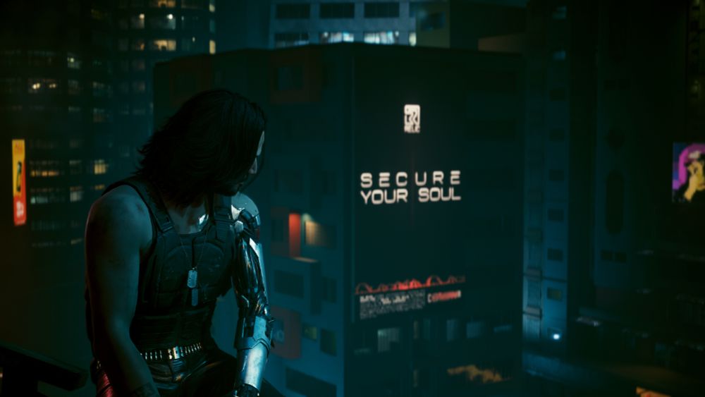 Johnny Silverhand and V (from their perspective) overlooking Night City. In the background, a black billboard with white lettering reads "Secure Your Soul," advertising Arasaka's Digital Engram service.