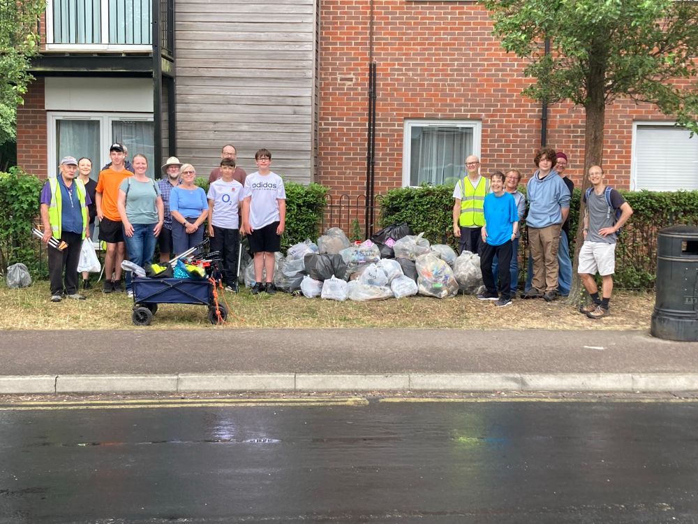 Keep Caversham Tidy stand divided beside their collected litter