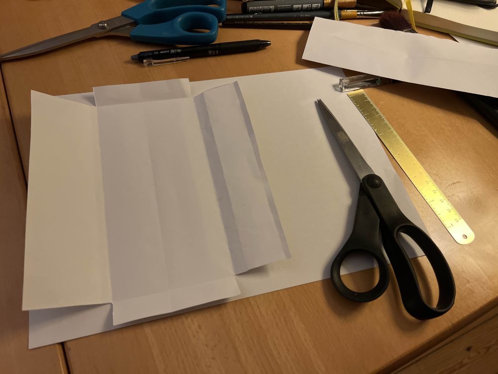 a rough template for the inner pocket of a money envelope.