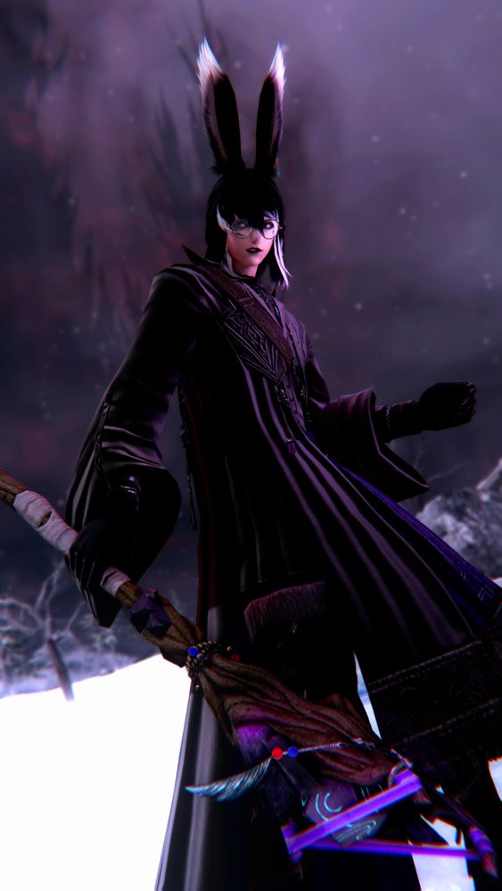 A male viera in a snowy field, with a foreboding tower in the background. He is wearing what appears to be wizard robes and a staff. His ears are alert to something off camera.