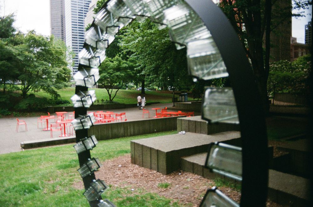 A couple in the center of a sculpture at Freeway Park