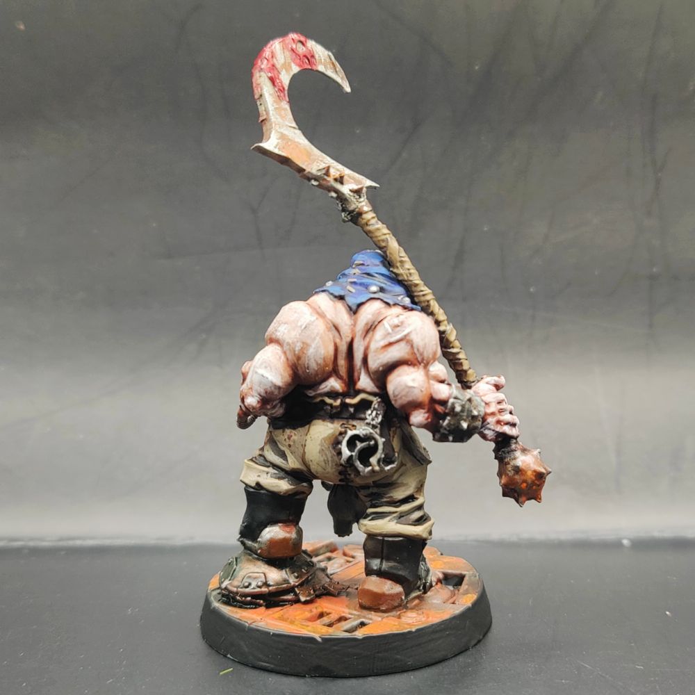 The back of the same Patsy, showing a broad expanse of pale flesh and the same blood soaked scythe