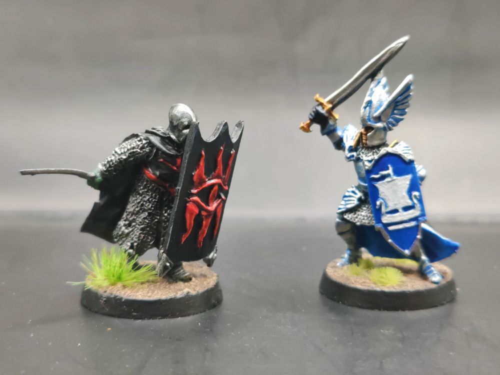 A black guard of Barad-dûr squares off against a noble knight Dol Amroth - the prettiest of knights