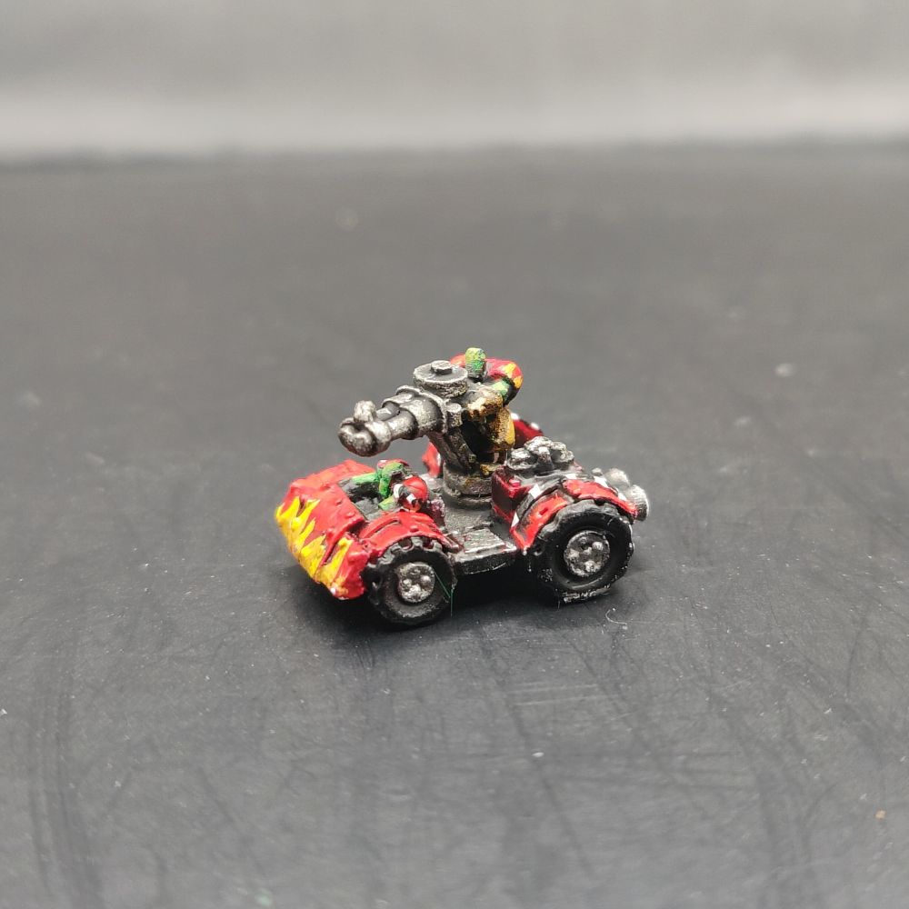 A teeny tiny ork buggy of the Evils Suns, with red armour to go faster and flames painted up the front