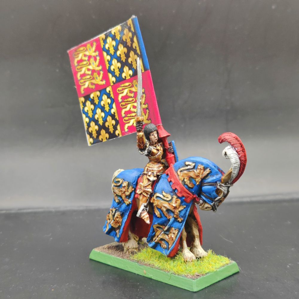 Repanse de Lyonesse holding aloft a banner showing golden lions on a red field and golden Fleur de lys on a blue field